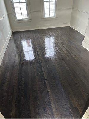 Red Oak floor sanded and stained with minwax ebony and 3 coats of pallman gold satin finish.