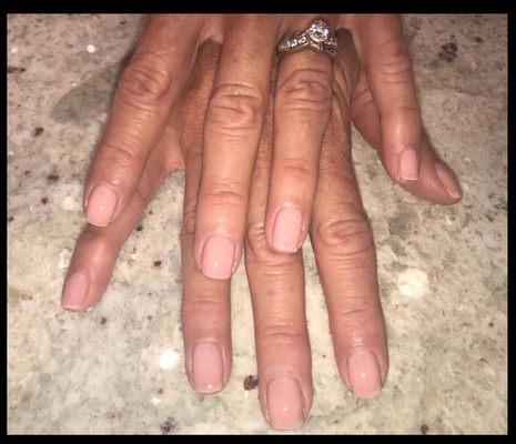 Basic Manicure - Trimming &/or shaping of the nail, buffing, cuticle trimming, scrub, 5 minute massage, & polish.