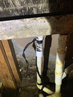 Condensation drip line that was leaking and previously repaired with electrical tape.