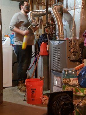 Nathan setting up the pipes for the water heater.