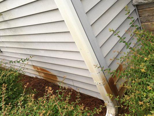 Heavy rust on siding and down spout