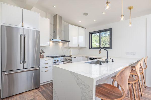 My Sonoma house project. Waterfall countertop and full height backsplash