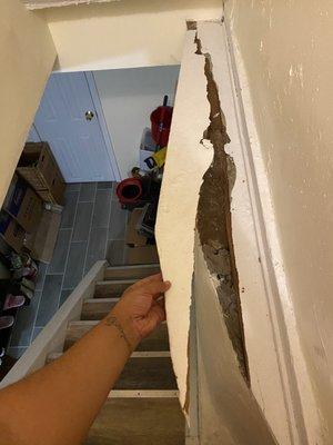 They broke the side of my landlords property, forcing the fridge that didn't fit down the stairs.