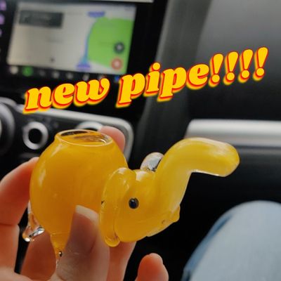 a small yellow elephant pipe. text overlay says "new pipe!!!!"