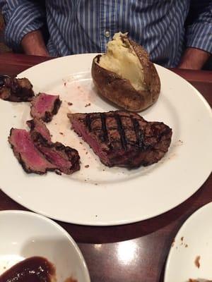 13 oz Kansas City strip dinner with a baked potato