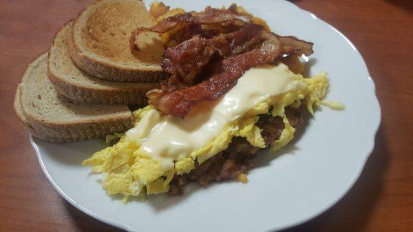 Corned beef hash w/ eggs plus rye toast and a side of bacon