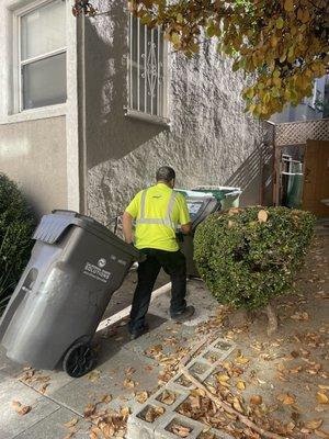 Pushing back recycling carts after they have been serviced