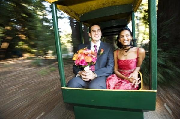 Newlyweds riding a train into cocktail hour at Nestldown.