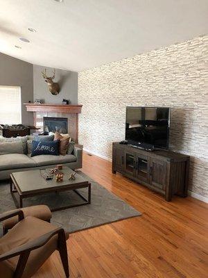 Stacked stone wallpaper installed in our client's game room