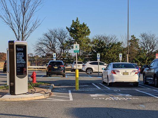 2 electric vehicle charging stations in front of Macy's side entrance with a 2 hour limit