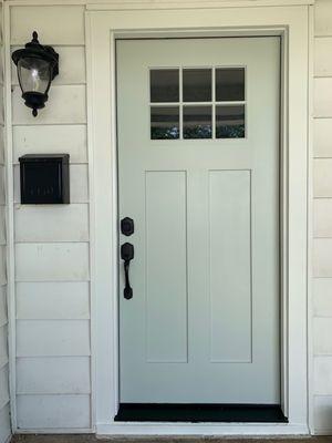 New front door, new trim, and door and trim painted.