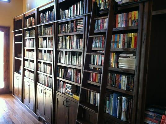 Bookshelves with a rolling ladder.