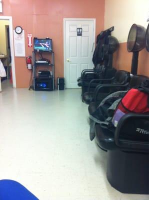 Plenty of hair dryers and a tv in the middle