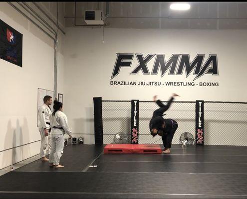 Brazilian Jiu-Jitsu - Practicing throws on the crash pad.