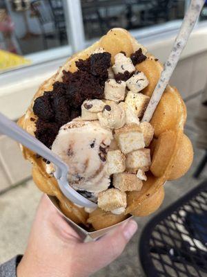 Waffle cone with brownie bites, cheesecake bites and cookie dough bites.