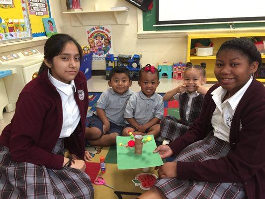 8th graders mentoring Pre-K students