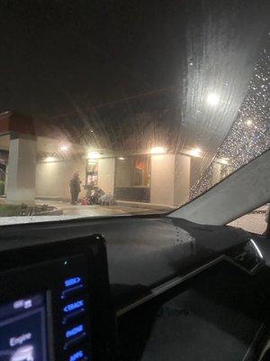 Employees outside while I'm waiting at the drive thru