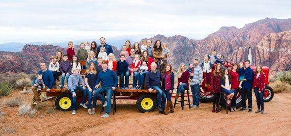 A multi-generational family of 44 on their caroling tractor and wagon, overlooking Snow Canyon, UT.