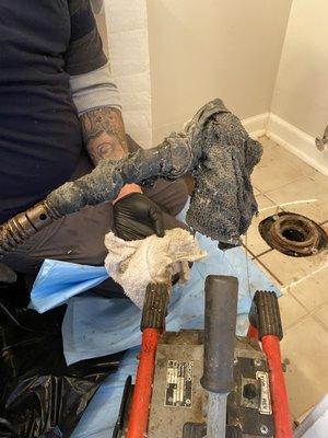 Worker's rag pulled from drain pipe.