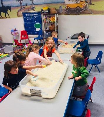 Sensory bins are our favorite activity.