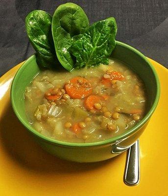 Vegan soup: lentils, carrots, squash, cabbage and basil