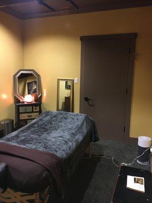 Massage room with door closed. Heated table and our quiet air filter on for the duration of your massage.