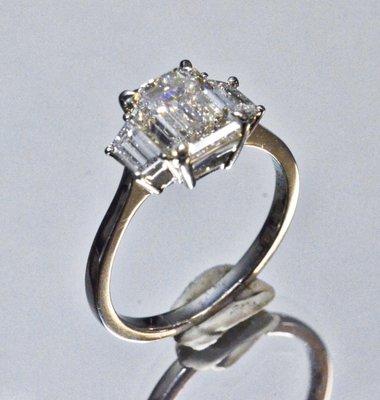 Center: 2.41ct Emerald cut diamond, GIA G-VS2 with 2 trapezoid diamonds tw. 0.41ct  Ring: Platinum