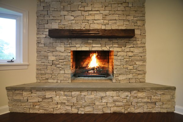 Floor to ceiling masonry fireplace