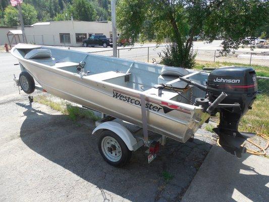 14 ft valco with accessories and 15 hp 4 stroke motor