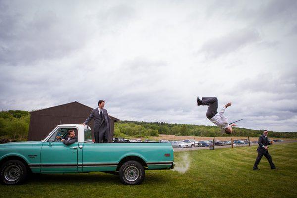 Grooms having fun at our Red Rooster Barn wedding venue in our vintage pick-up truck.