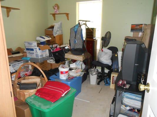 Before:  A "catch all" room of household stuff.