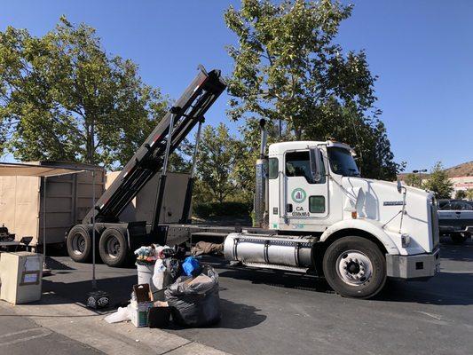 Watching the changing of the guard ceremony (dropping off a new conex container for the recycling center).