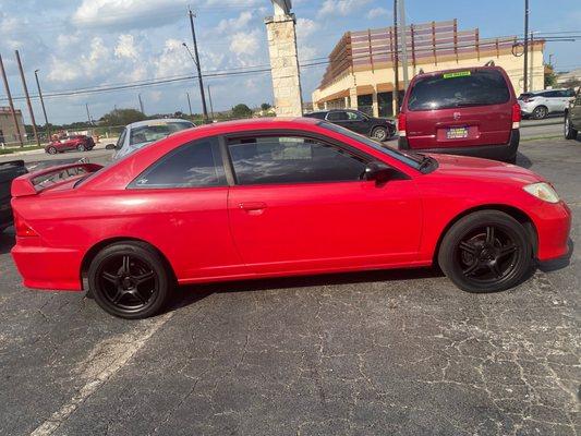 Side view of 2005 red Honda Civic