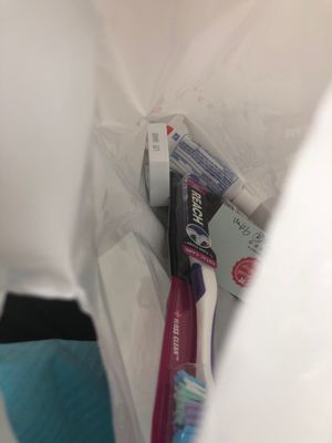 Inside the grab bag is floss, toothpaste, mouthwash and a toothbrush. Nice!