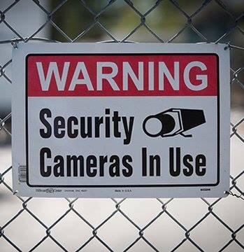 Surveillance cameras & security lighting surround our property.