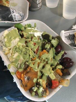 salad with seasonal vegetables, tzatziki, skordalia, olives, roasted red peppers, stuffed grape leaves and pistachio pesto dressing