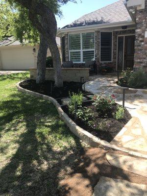 Refreshed beds and earlier flagstone patio