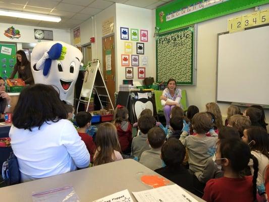 Our treatment coordinator out in the classroom teaching the importance of taking care of your teeth