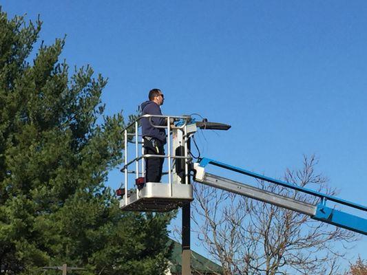 Technician Changing Pole Light