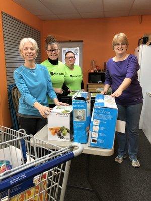 Our staff helping at Bread of Life Food Pantry.