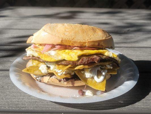 The Super Chilaquiles Torta with fresh grilled Angus carne asada