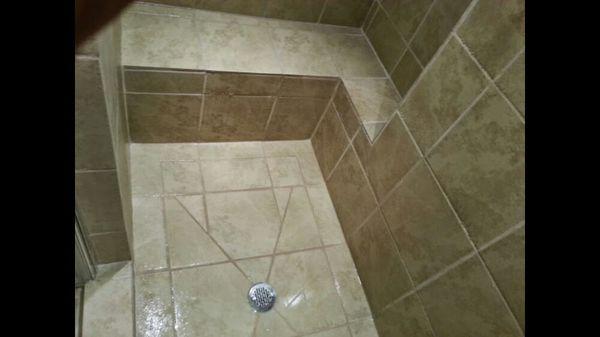 Complete remodel bathroom. Tiled shower with bench.