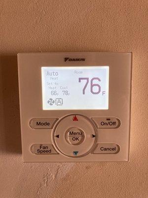 Wall mounted thermostat for main living area