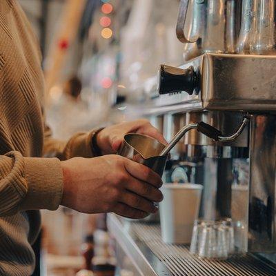 Barista steaming milk