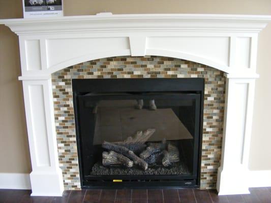 Update your fireplace with tile, stone or glass