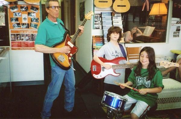 Scott Anderson jamming it up with his bass student and one of our drum students. Ask about bands forming for your young musician