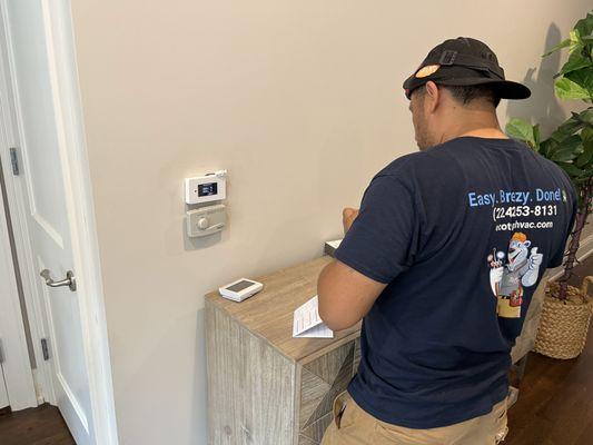 Smart thermostat installation and programming.