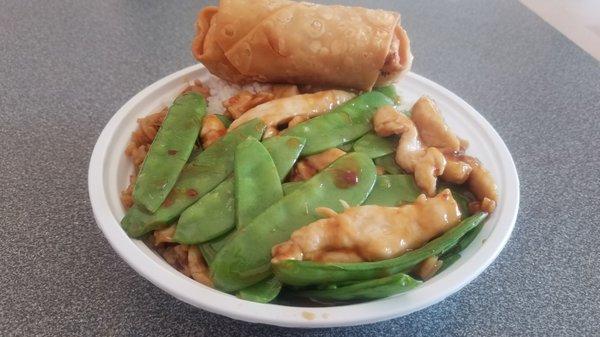 Chicken, pea pods, white and fried rice, egg roll.