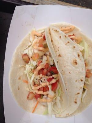 Fish Tacos, grilled seasonal fish, flour tortillas, shredded cabbage and pick de gallo.