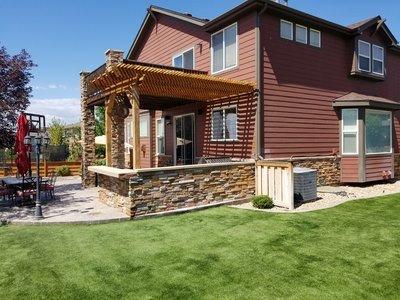 Veneer Stone wall, Wood Pergola, Artificial turf